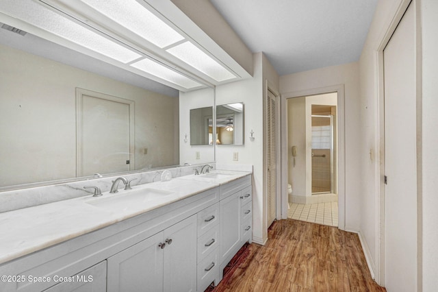 818 Spanish Wells Dr, Melbourne, FL 32940 - full bath with toilet, visible vents, a sink, and a stall shower