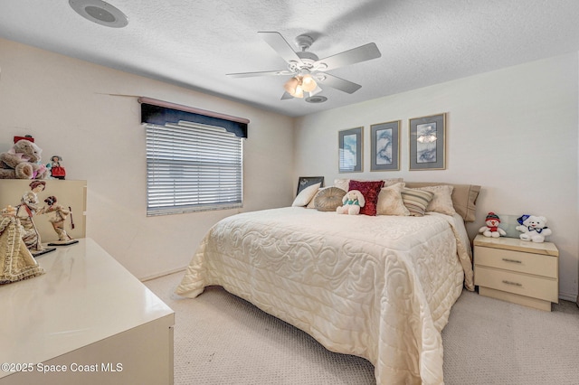 818 Spanish Wells Dr, Melbourne, FL 32940 - bedroom with ceiling fan, a textured ceiling, and light colored carpet