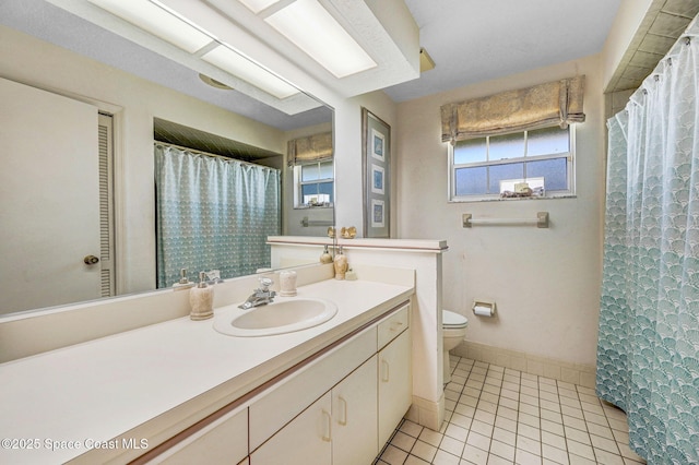 818 Spanish Wells Dr, Melbourne, FL 32940 - bathroom with vanity, curtained shower, baseboards, toilet, and tile patterned flooring