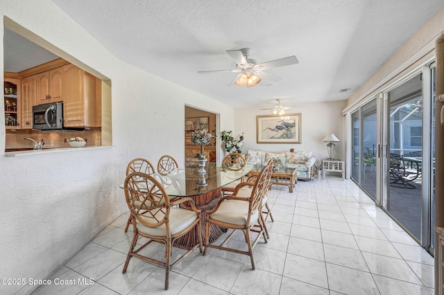 818 Spanish Wells Dr, Melbourne, FL 32940 - dining room with a textured ceiling, a ceiling fan, and visible vents