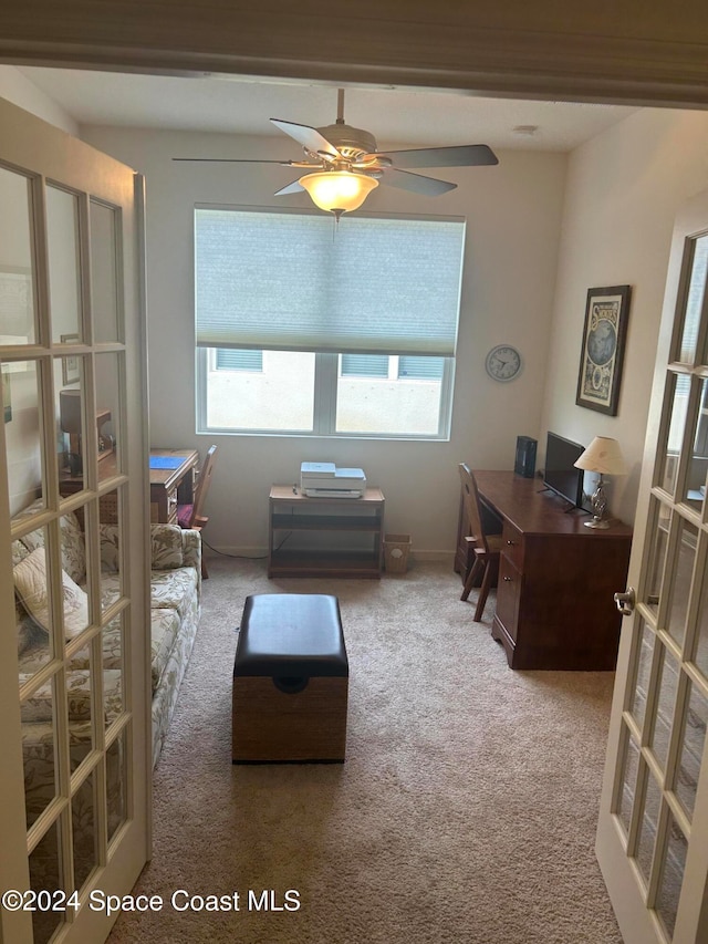 interior space with plenty of natural light, french doors, and carpet floors