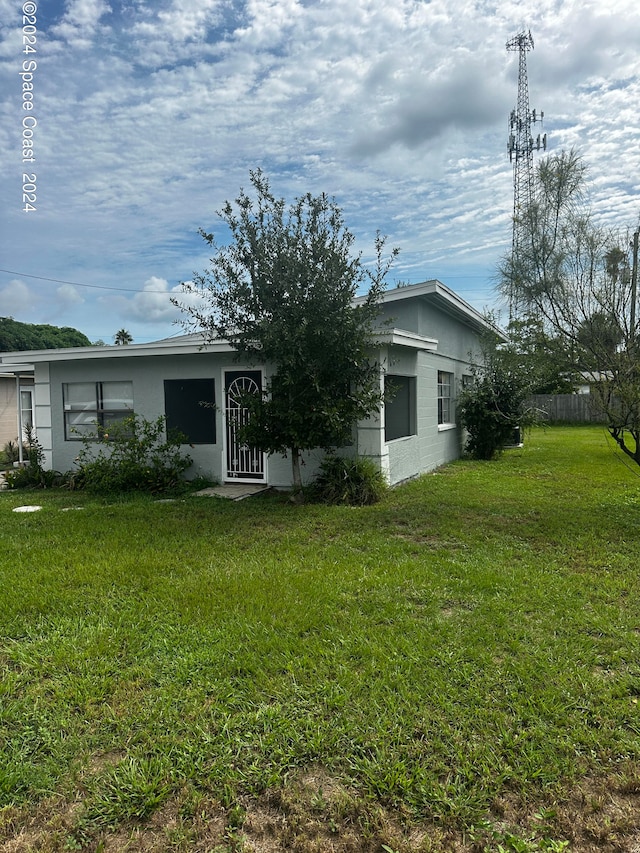 view of front of home with a water view