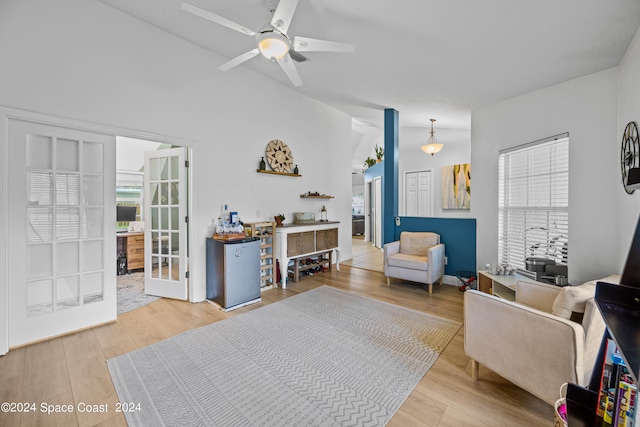 living room with ceiling fan and hardwood / wood-style flooring