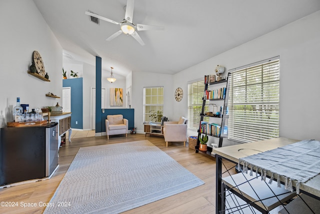 bedroom with vaulted ceiling, ceiling fan, and hardwood / wood-style floors