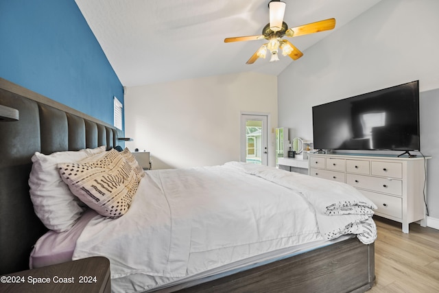 bedroom featuring lofted ceiling, ceiling fan, and light hardwood / wood-style flooring