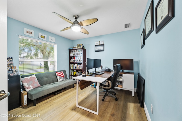 office featuring hardwood / wood-style floors and ceiling fan