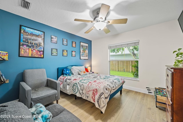 bedroom featuring ceiling fan and light wood-type flooring