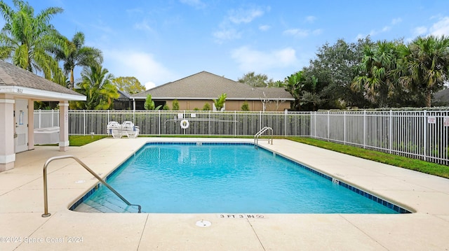 view of swimming pool featuring a patio area