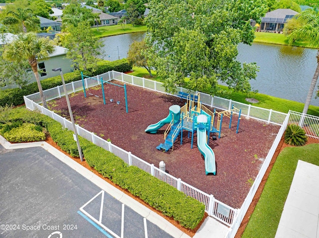 view of playground with a water view