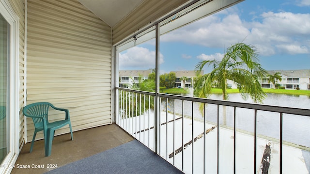 balcony featuring a water view