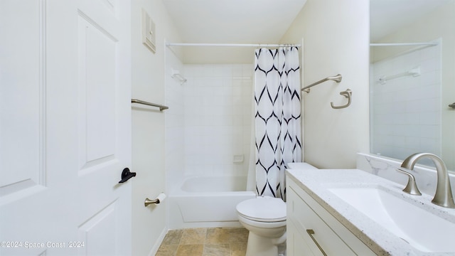 full bathroom with vanity, shower / tub combo with curtain, and toilet