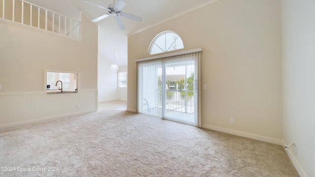 interior space with sink, high vaulted ceiling, and ceiling fan