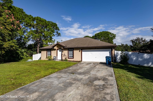 ranch-style house featuring a garage and a front lawn