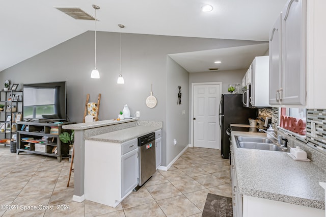 kitchen featuring lofted ceiling, sink, decorative light fixtures, white cabinetry, and stainless steel appliances