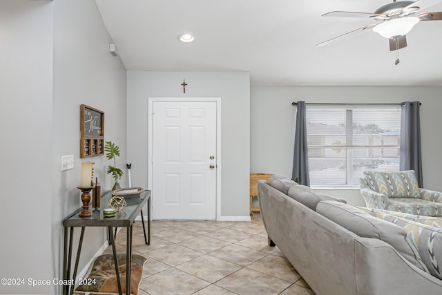 living room with ceiling fan and light tile patterned floors