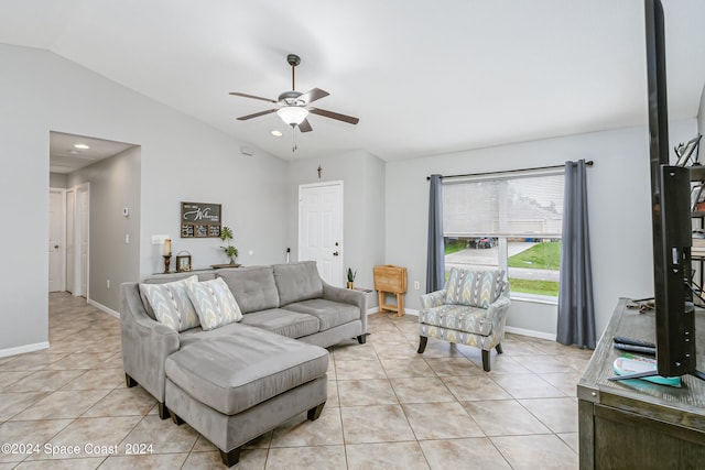 living room featuring ceiling fan, light tile patterned flooring, and lofted ceiling