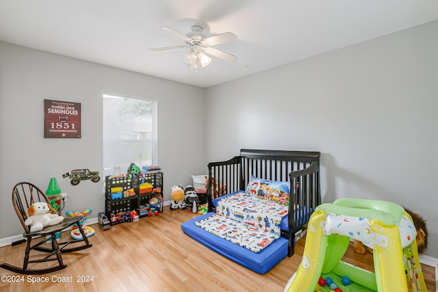 bedroom with hardwood / wood-style flooring and ceiling fan