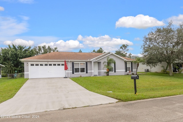 single story home with a front yard and a garage