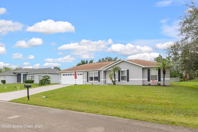 ranch-style home featuring a garage and a front yard