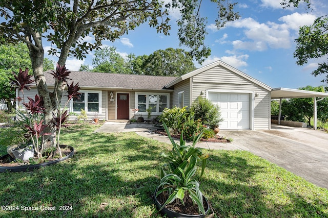 single story home with a garage, a carport, and a front lawn