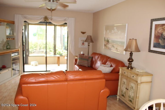 living room featuring ceiling fan and light wood-type flooring