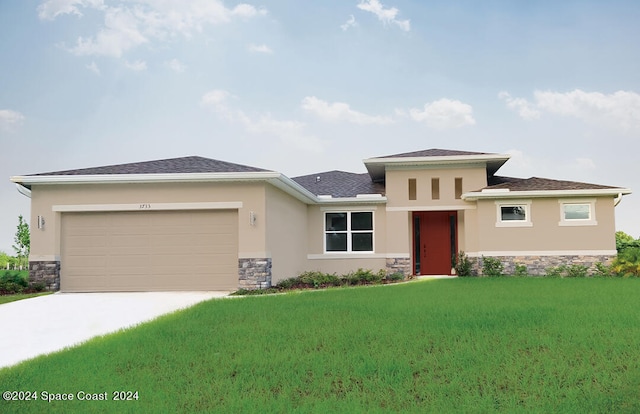 prairie-style home with a garage and a front lawn