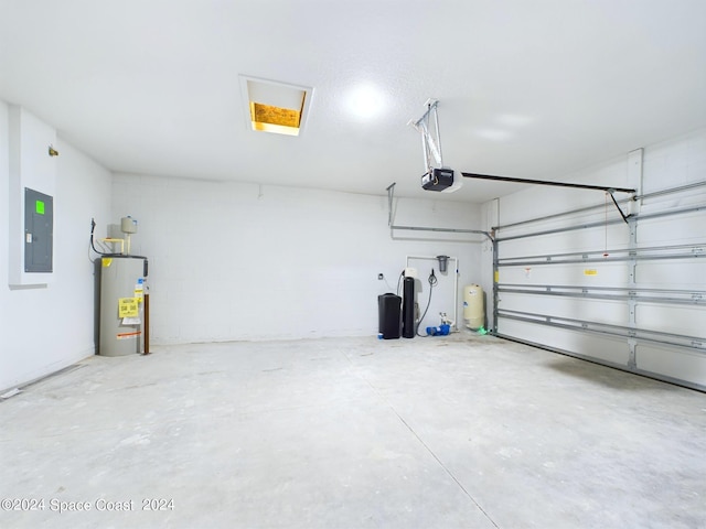 garage with a garage door opener, water heater, and electric panel