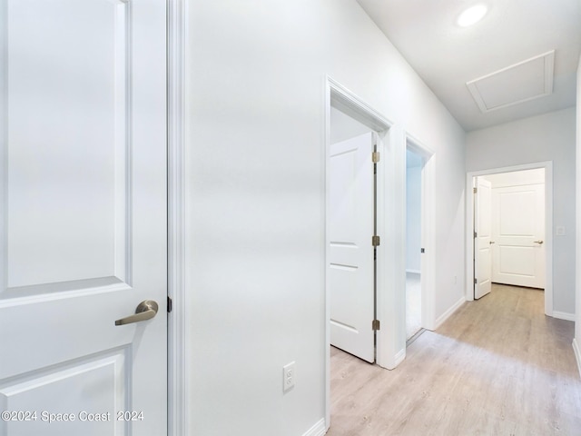 hallway with light wood-type flooring