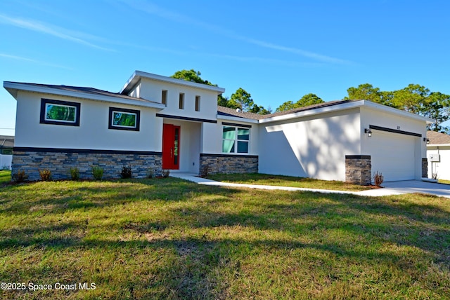 view of front of property with a front yard and a garage