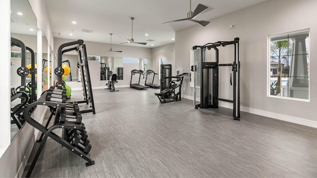 workout area featuring ceiling fan and hardwood / wood-style floors