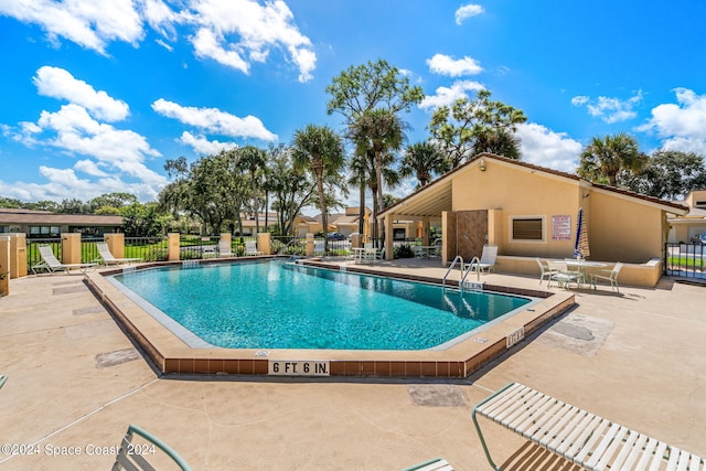 view of swimming pool with a patio area