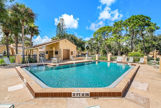 view of swimming pool featuring a patio area