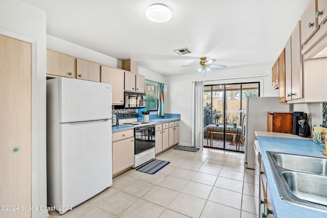 kitchen featuring ceiling fan, light tile patterned flooring, white appliances, light brown cabinetry, and decorative backsplash