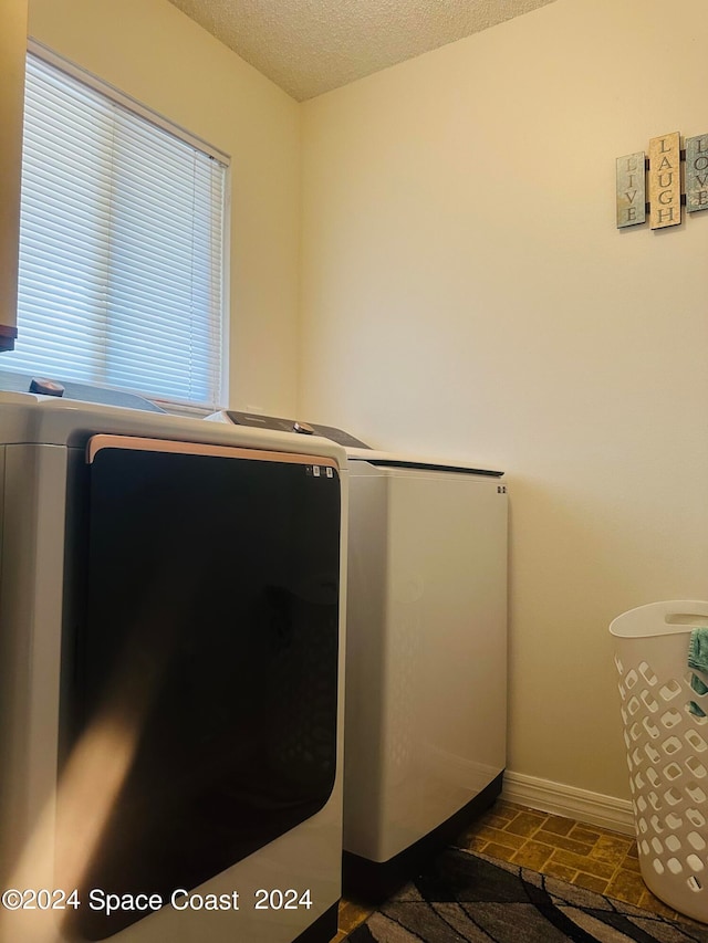 laundry area featuring a textured ceiling