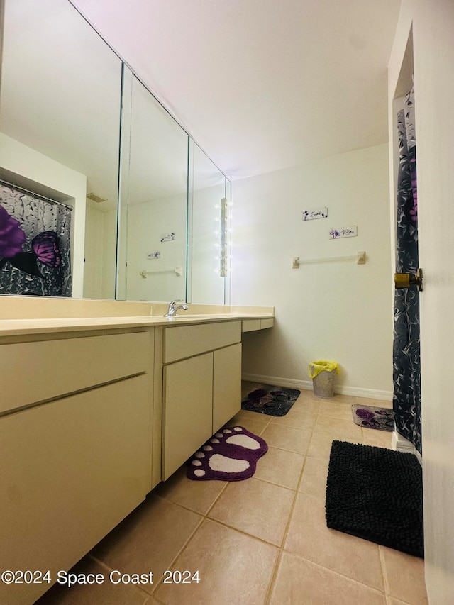 bathroom featuring tile patterned flooring and vanity