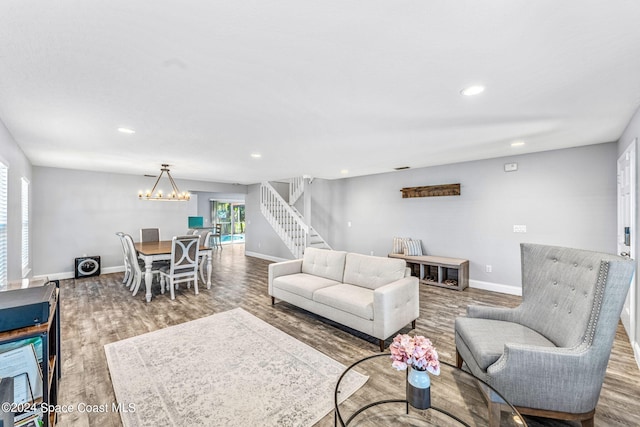 living room with a chandelier and hardwood / wood-style flooring