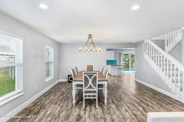 dining area with wood finished floors, baseboards, stairway, recessed lighting, and a chandelier