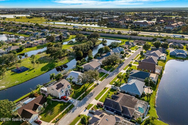 bird's eye view featuring a residential view and a water view