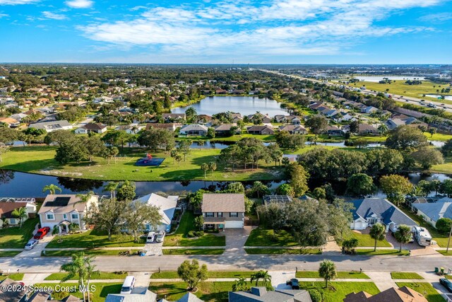 drone / aerial view with a water view