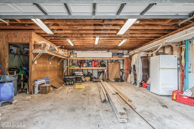 garage featuring white fridge