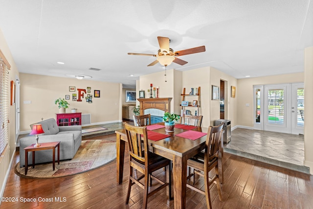 dining room with hardwood / wood-style flooring and ceiling fan