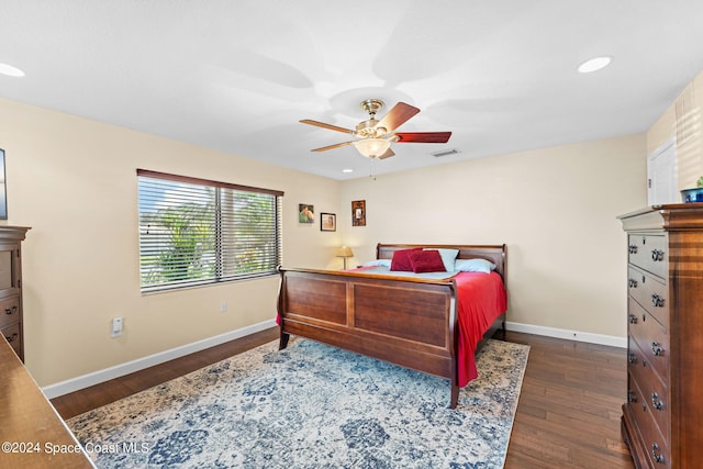 bedroom with dark wood-type flooring and ceiling fan