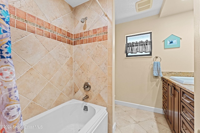 bathroom with vanity, shower / tub combo, a textured ceiling, and tile patterned floors