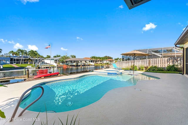 view of pool with a lanai, a water view, an in ground hot tub, and a patio