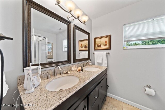 bathroom featuring tile patterned flooring and vanity