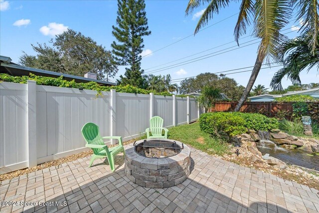 view of patio / terrace featuring a fire pit