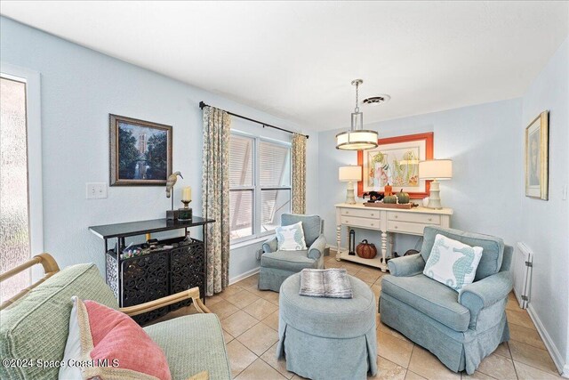 living area featuring light tile patterned floors