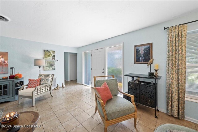 sitting room with light tile patterned floors