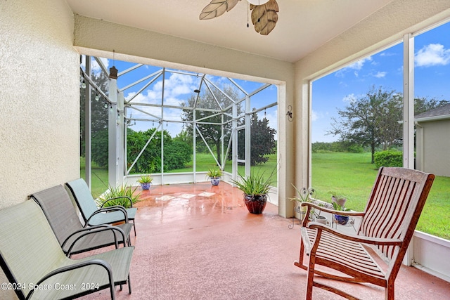 sunroom with a ceiling fan