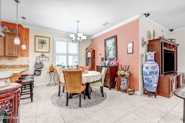 dining space featuring light tile patterned flooring, visible vents, baseboards, ornamental molding, and an inviting chandelier